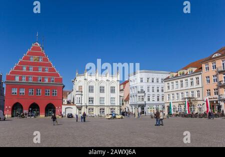 Historic buildings at the central market square of Hanseatic city Greifswald, Germany Stock Photo