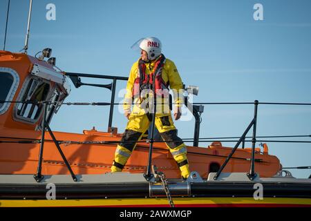 Lifeboatman on RNLI Lifeboat, Freddie Cooper. Aldeburgh, Suffolk. UK Stock Photo
