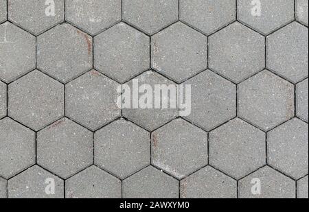 The texture of concrete hexagonal paving tiles close-up Stock Photo