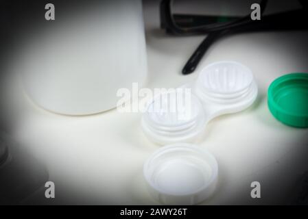 Glaucoma surrounding contact lens case with other eye care products Stock Photo
