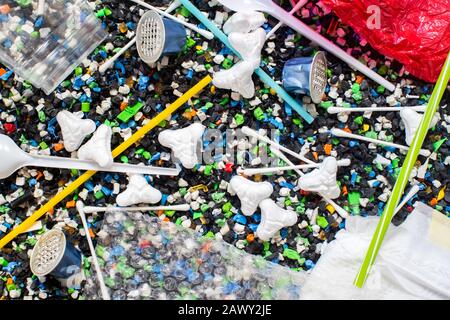Non Recyclable Single Use Plastic Waste On Shredded Plastic Environmental Concept Stock Photo