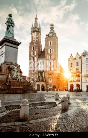 Adam Mickiewicz monument and St. Mary's Basilica on Main Square in Krakow, Poland Stock Photo