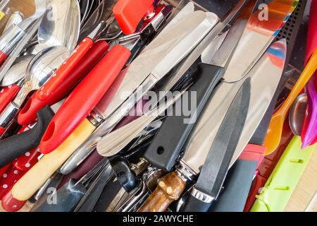 Close up view of kitchen knives and other cutlery Stock Photo
