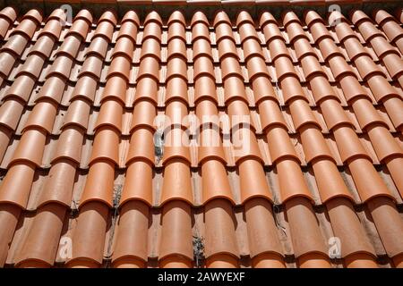 Overhead image of a terracotta clay tiled roof. Possible background image. Stock Photo