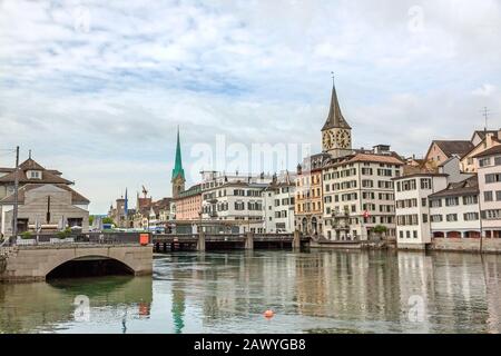 Zurich downtown, with Fraumunster and St. Peter. View towards Lindenhof, Schipfe street, river Limmat in front. Stock Photo