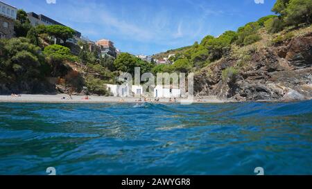 Spain Costa Brava, beach in Portbou town seen from water surface, Mediterranean sea, Catalonia, Alt Emporda Stock Photo