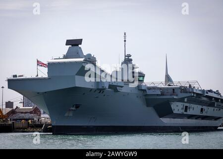 Viewed from the bow, newly launched Aircraft carrier HMS Queen Elizabeth in dock in Portsmouth, UK. Stock Photo