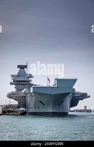 Viewed from the bow, newly launched Aircraft carrier HMS Queen Elizabeth in dock in Portsmouth, UK. Stock Photo