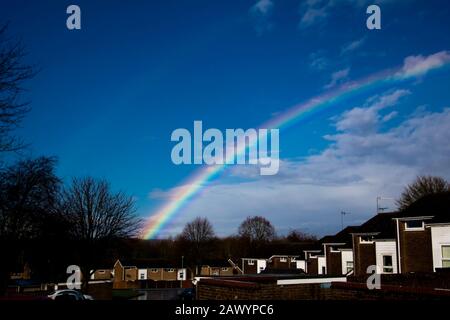 Climate change, Rainbow after the storm, Droitwich Spa. Worcestershire, United Kingdom, 10/02/2020 , The rainbow glows in  full colour with the sun after the storm Ciara Stock Photo