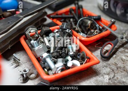 different types of screws in a plastic box Stock Photo