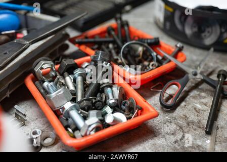 different types of screws in a plastic box Stock Photo