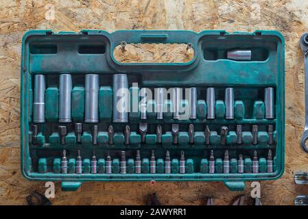 a set of socket wrenches in a plastic box in a workshop Stock Photo