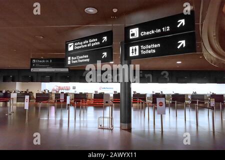 Zurich, Switzerland - June 11, 2017: Zurich airport, Check-in desk 3, sign to departure gates, tram, toilets Stock Photo