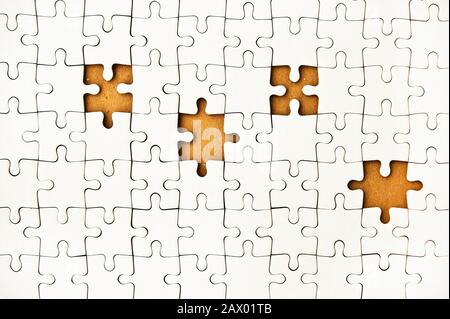 blank jigsaw puzzle with missing pieces Stock Photo