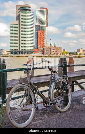 Parked bicycle in front of the river Maas in Rotterdam, The Netherlands Stock Photo