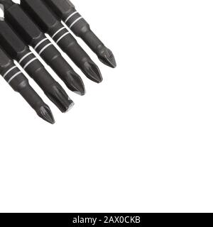 Set of various types of bits for screwdrivers and drills isolated on white background. Stock Photo