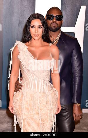 BEVERLY HILLS, CA - FEBRUARY 09: Kim Kardashian-West and Kanye West attend the 2020 Vanity Fair Oscar Party hosted by Radhika Jones at Wallis Annenberg Center for the Performing Arts on February 24, 2019 in Beverly Hills, California. Stock Photo