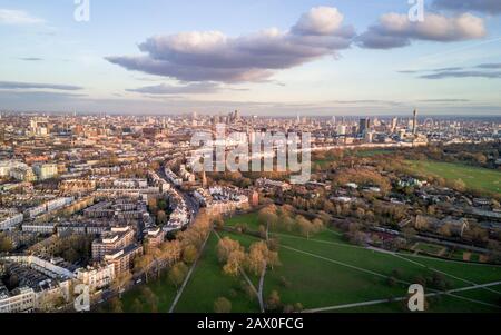 London skyline. Aerial drone photo from Primrose Hill in North London looking south with many key landmarks in view.