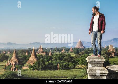 Traveler looking over the ancient ruins of Bagan, Myanmar (Burma). Stock Photo