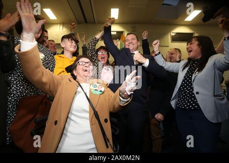 Dublin, Ireland. 9th Feb, 2020. General Election 2020. Counting of votes. Man of the moment Paul Donnelly of Sinn Fein celebrates with his mother Bridie (left), and family and supporters after being elected on the first count in the count centre in the Phibblestown Community Centre in Dublin West. He came in ahead of the Taoiseach Leo Varadkar, who was only elected on the 5th count. Photo: Eamonn Farrell/RollingNews.ie/Alamy Live News Credit: RollingNews.ie/Alamy Live News Stock Photo