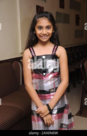 A little girl sitting Mumbai Maharashtra India Stock Photo - Alamy