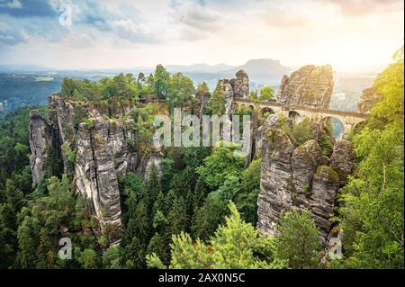 Beautiful panoramic view of famous Bastei Bridge with Elbe Sandstone mountains in Saxon Switzerland National Park in spring, Saxony, Germany Stock Photo