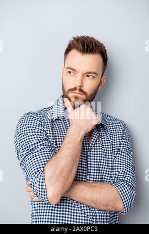 Portrait of young thoughtful businessman thinking about his work Stock Photo