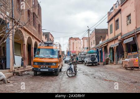 Tighedouine, Morocco - January 16, 2020: Main street of Tighedouine with regular human and car traffic Stock Photo