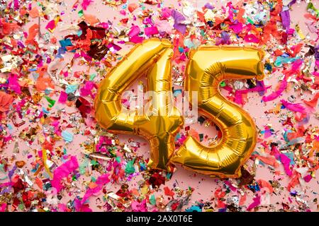 45th birthday celebration background with gold balloons and golden ...
