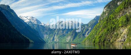 Classic panoramic view of traditional tourist boat on famous Lake Konigssee on a beautiful sunny day in summer, Berchtesgadener Land, Bavaria, Germany Stock Photo