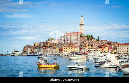 Scenic panoramic view of famous old town of historic mediterranean city Rovinj with busy tourist harbour in the north Adriatic sea, Istria, Croatia Stock Photo