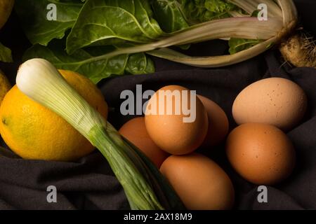 Fresh eggs freshly laid by raw and fresh hens and vegetables, freshly picked from the garden. Ecological, healthy and healthy products. Stock Photo