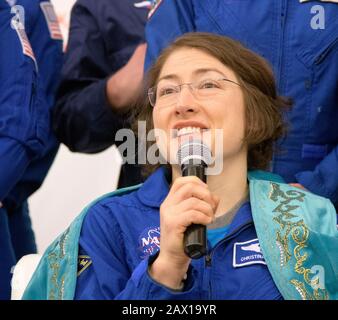 NASA astronaut Christina Koch answers questions from the media after arriving at the Karaganda Airport welcome ceremony following a successful landing aboard the Soyuz MS-13 spacecraft touched down with fellow crew members, Roscosmos cosmonaut Alexander Skvortsov, and ESA astronaut Luca Parmitano February 6, 2020 in Zhezkazgan, Kazakhstan. Koch returned to Earth after logging 328 days in space, the longest spaceflight in history by a woman, as a member of Expeditions 59-60-61 on the International Space Station. Stock Photo