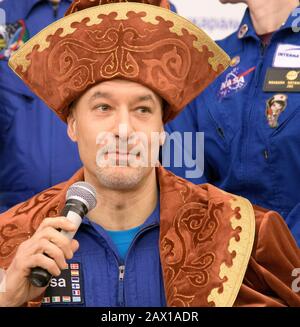 ESA astronaut Luca Parmitano wearing a traditional Kazakh hat during a press conference following a successful landing aboard the Soyuz MS-13 spacecraft touched down with fellow crew members, Roscosmos cosmonaut Alexander Skvortsov, and NASA astronaut Christina Koch at the Karaganda Airport February 6, 2020 in Zhezkazgan, Kazakhstan. Koch returned to Earth after logging 328 days in space, the longest spaceflight in history by a woman, as a member of Expeditions 59-60-61 on the International Space Station. Stock Photo