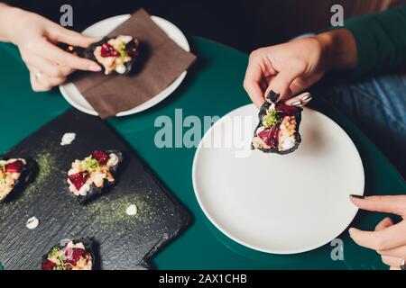 Different types of canapes on buffet table Stock Photo