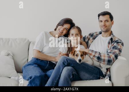 Mom And Daughter In Jeans Cuddle Laughing Stock Photo - Alamy