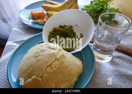 a close up shot of a plate of ugali served on a table Stock Photo