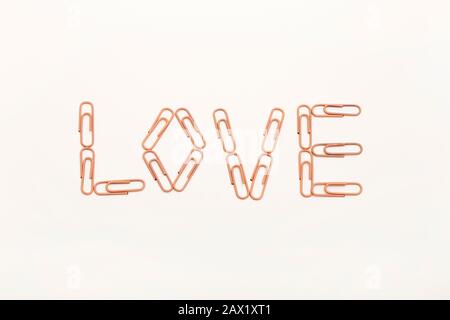 love shaped paperclips on white background Stock Photo