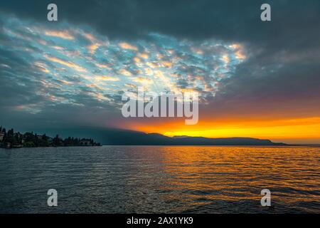 Italy Lombardy Garda Lake Gardone Riviera -Sunrise on  the lake from the Grand Hotel Fasano Stock Photo