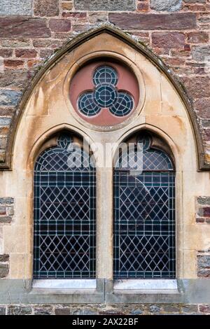 Close up of old stained glass window at church in Lynmouth Stock Photo