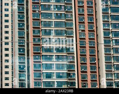 Close up of windows of high rise city apartment tower block, China, Asia Stock Photo