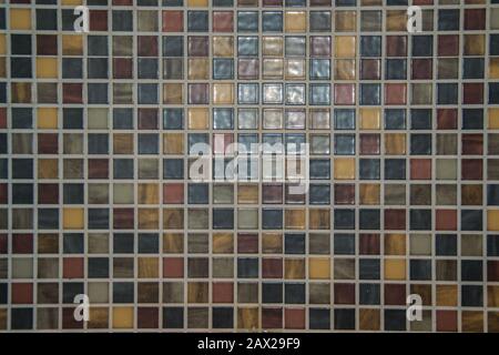 Mosaic of small square tiles in brown, beige and amber colors, colorful background, modern pattern Stock Photo
