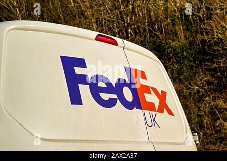 CARDIFF, WALES - JANUARY 2020: Close up of the FedEx logo on a delivery van parked on a road near Cardiff Stock Photo