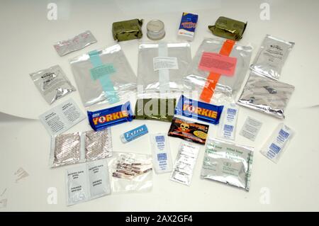 A 24 hour ration pack issued to soldiers serving in Afghanistan in 2005. The high-calorie packs are standard issue for the British Armed Forces on operations and, it's claimed, contain enough food to last one person 24 hours.Oatmeal bock, biscuits, tissues, Yorkie bar, fruit flavoured sweets, Lamb stew with potatoes, chicken sausages and beans in tomato sauce, Fruit dumplings in custard, dried orange juice, coffee powder, chicken and sweetcorn soup.chewing gum, Chicken and herb pate, Hot pepper sauce, vegetable stock drink. Beverage whitener, chocolate flavoured drinking powder, instant tea. Stock Photo