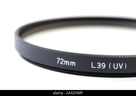 Close-up of camera UV-filter on white background. Stock Photo