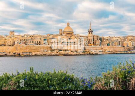 Valletta, Malta old town skyline from Sliema city on the other side of harbor during sunrise Stock Photo