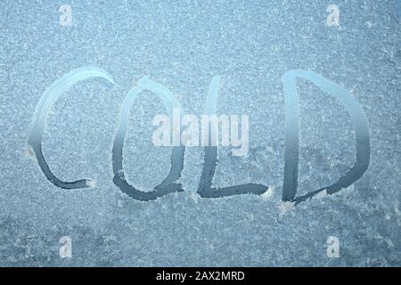 The inscription on frozen window pane. Words written on blurry translucent background. Stock photo with empty space for text. For web, print, background and wallpaper Stock Photo
