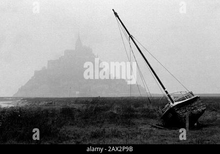 AJAXNETPHOTO. OCTOBER, 1982. MONT SAINT-MICHEL, FRANCE. - MIST SHROUDED MOUNT - THE FAMED NORMANDY LANDMARK SHROUDED IN MIST ON AN AUTUMN DAY.PHOTO:JONATHAN EASTLAND/AJAX REF:821007 9036 1