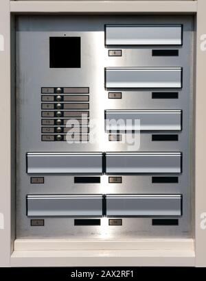 Apartment door bell and numbers without names on the tags Stock Photo