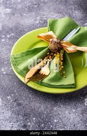 Easter table setting with green plate Stock Photo
